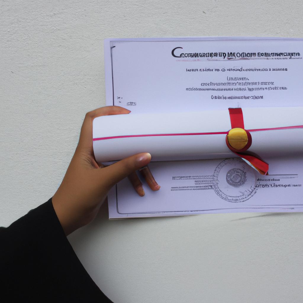 Person holding graduation certificate